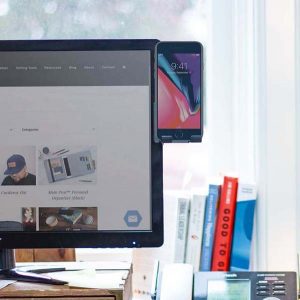 Moniclip attached to the side of a computer monitor