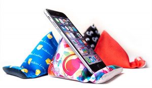 Multi-colored Desk Wedge holding a cell phone