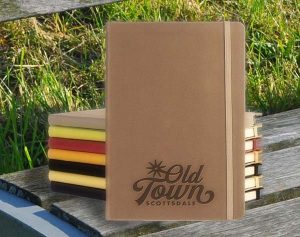 Brown Appeel Journal with other colored journals stacked behind it