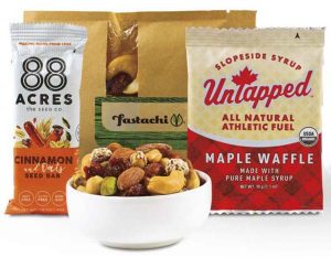 Healthy snack pack example with a snack bar and bowl of nuts