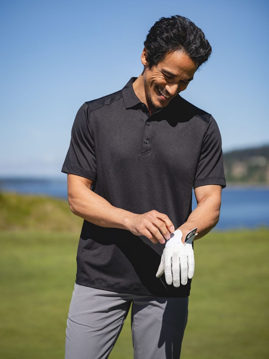 Golfer wearing Forge polo